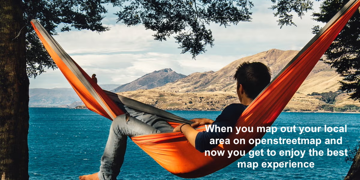 Guy relaxing on a orange hammock facing towards the water with a dry mediterranean landmass on the otherside with the caption “When you map out your local area on openstreetmap and now you you get to enjoy the best map experience”